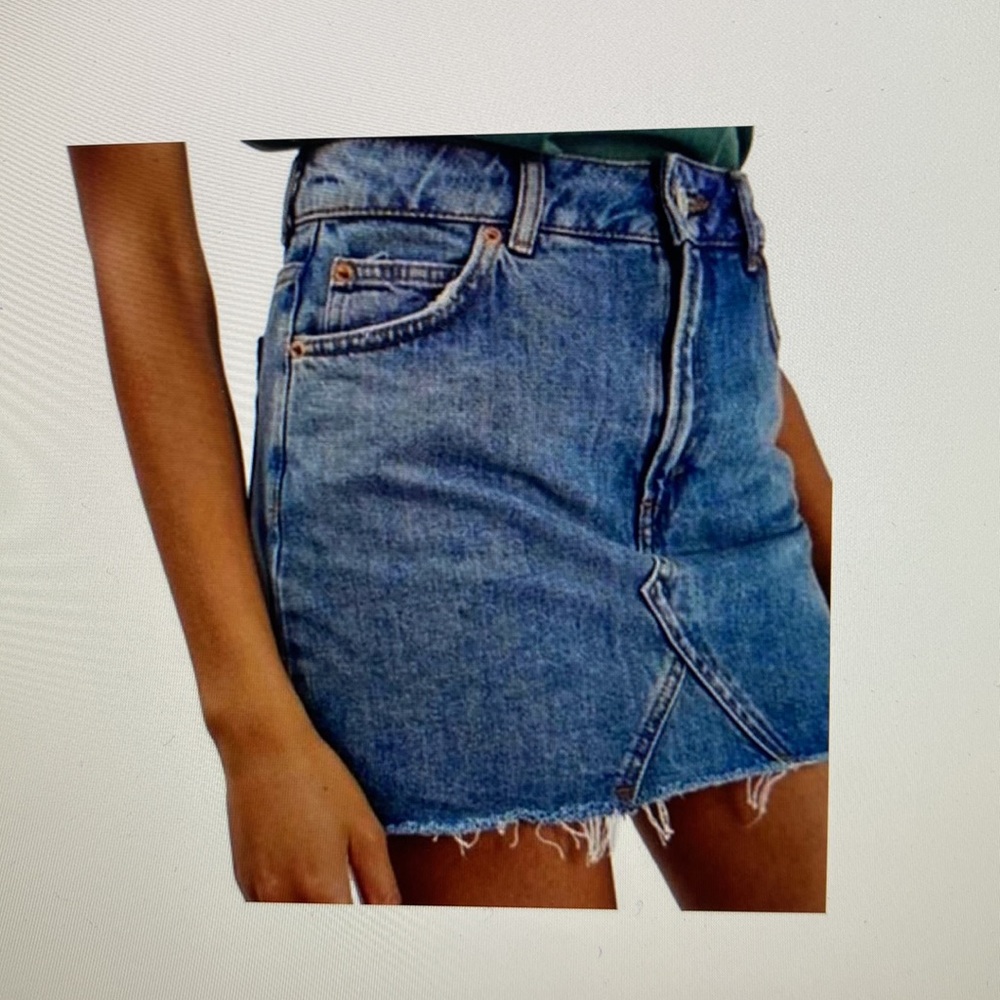 Topshop Moto blue denim skirt. Raw edge hem